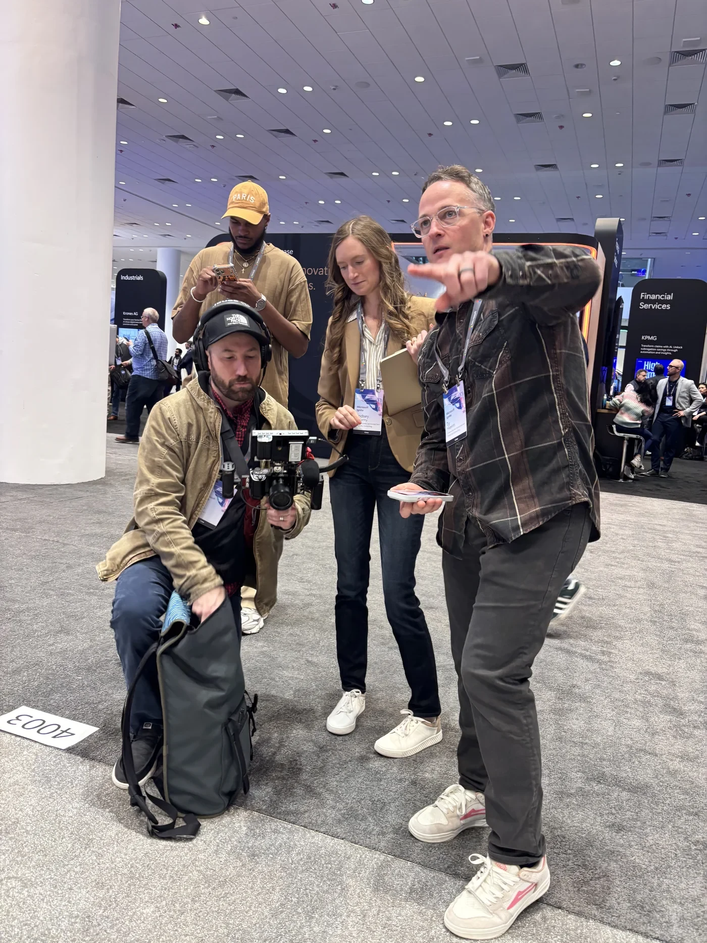 Ty Hagerott directing a production crew on an event exhibition floor